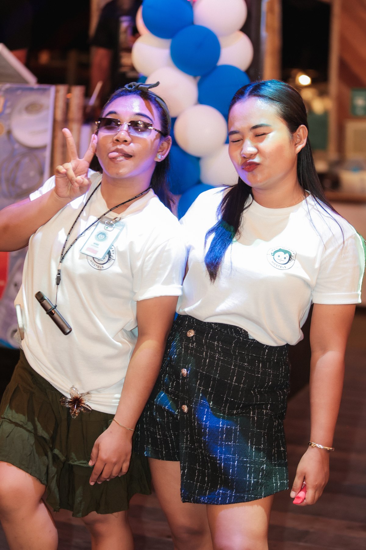 Two Mad Monkey staff in uniform on shift